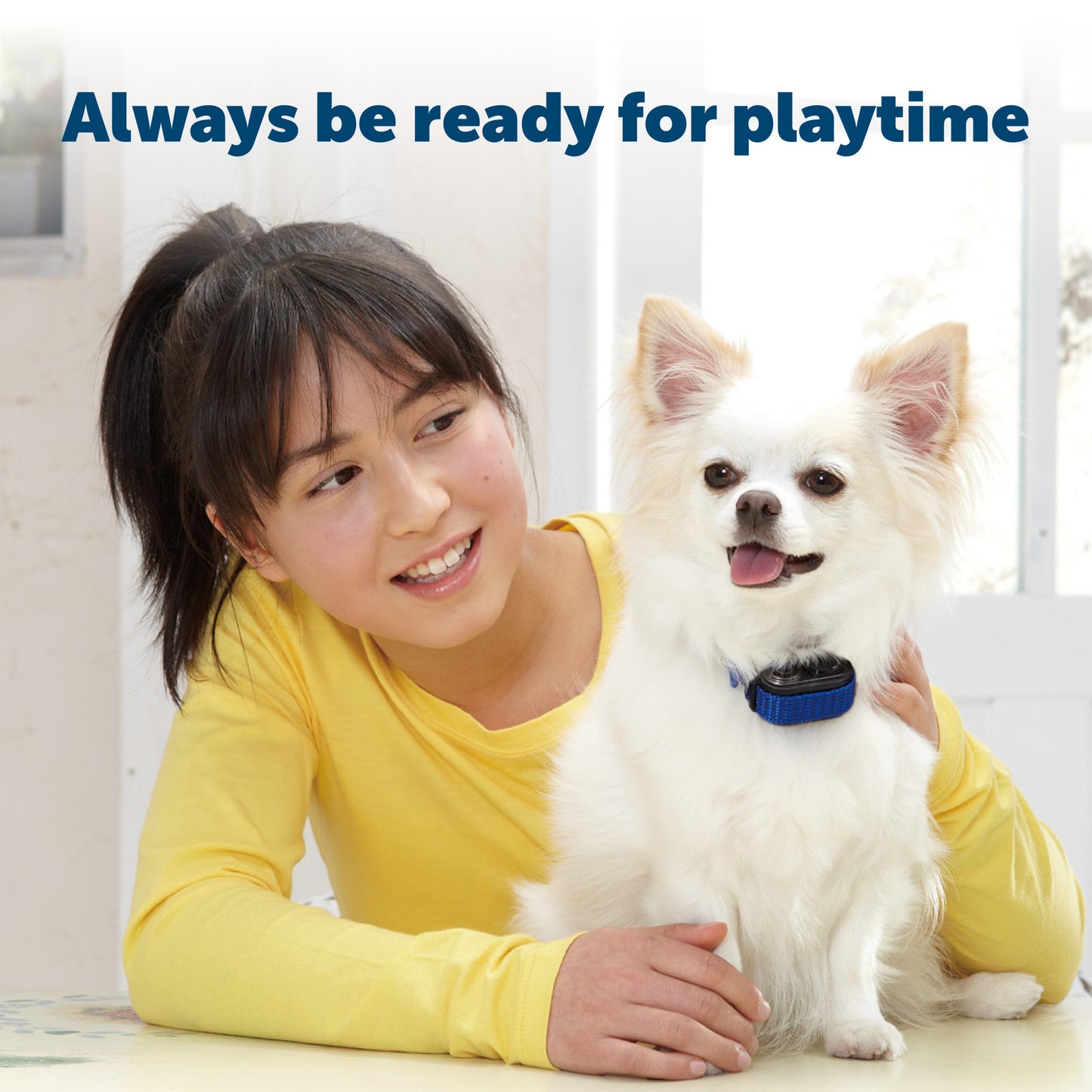 child and dog in home ready to play