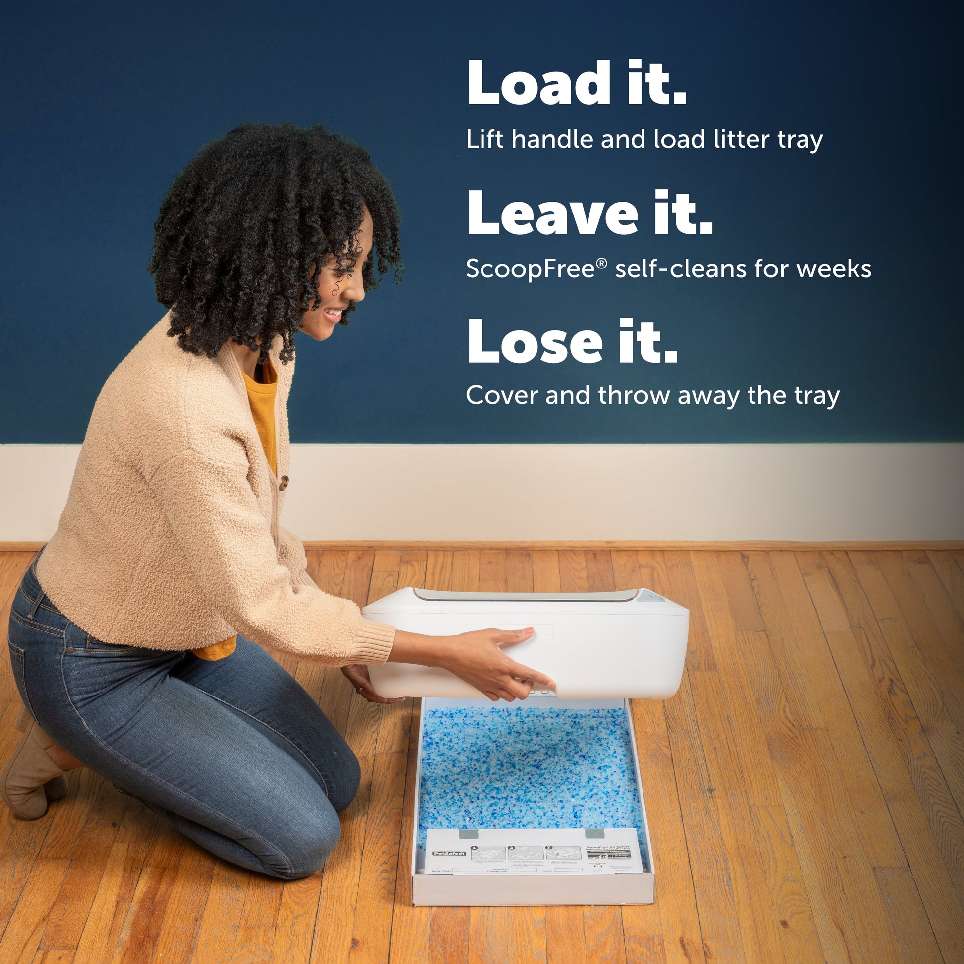 Woman loading a litter tray with text about ScoopFree self-cleaning system